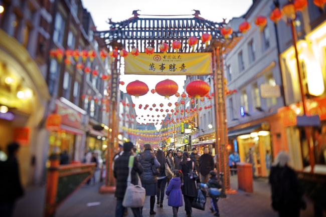 gate with shoppers in china town