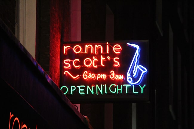 neon sign at night of Ronnie Scott's Open Nightly