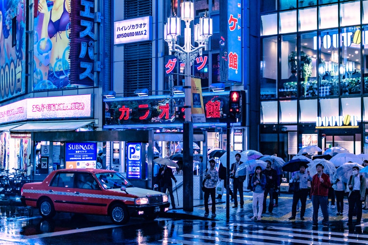 A street view of night time Shinjuku Japan 